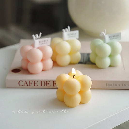 A square ball-shaped scented candle